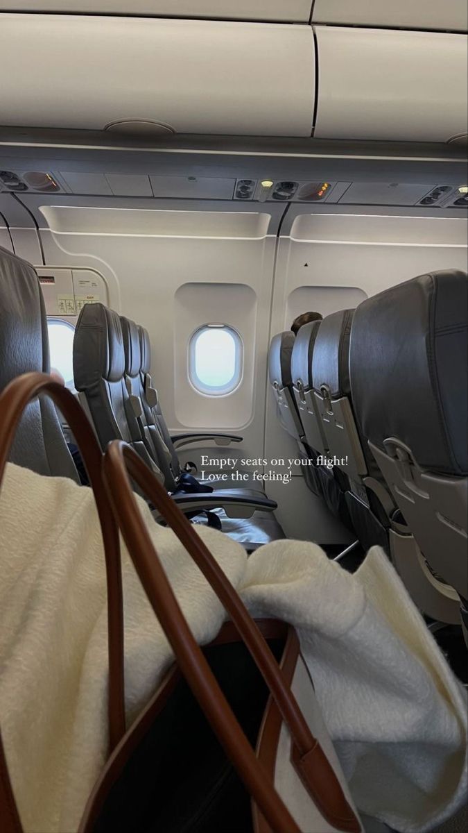 the inside of an airplane with leather seats