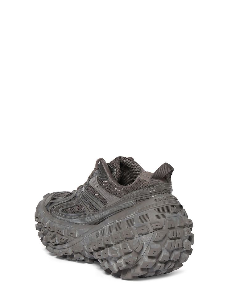 a pair of gray shoes on a white background