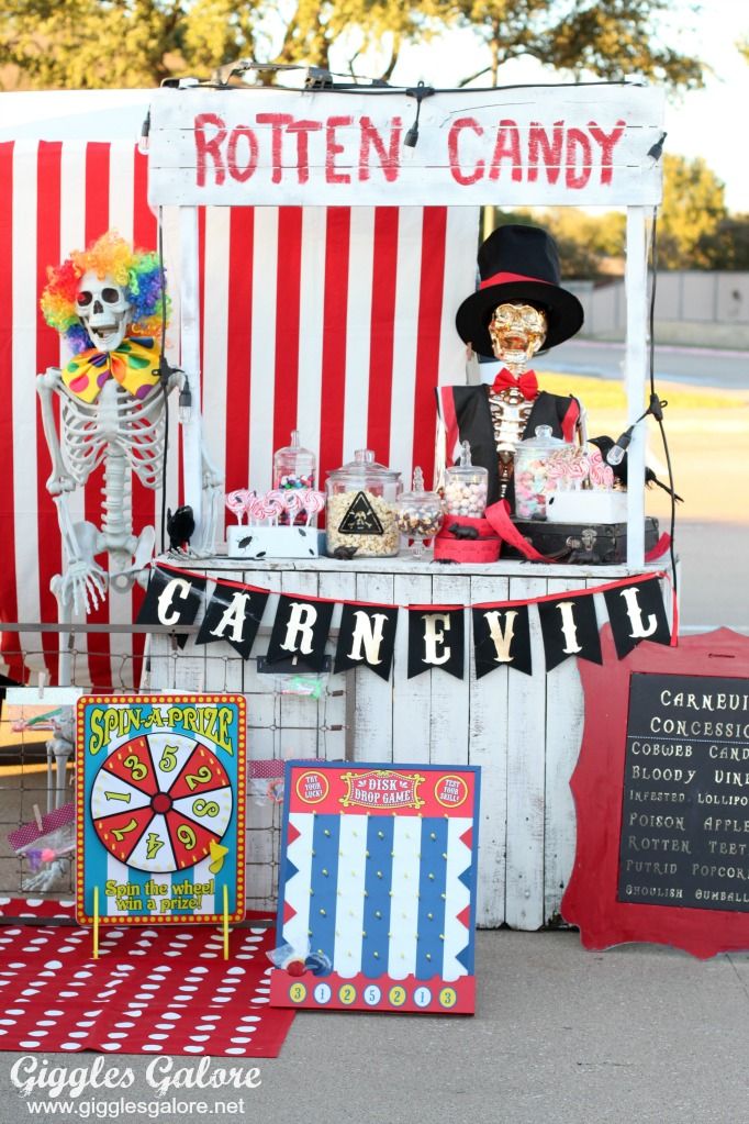 a carnival booth with skeleton decorations and candy