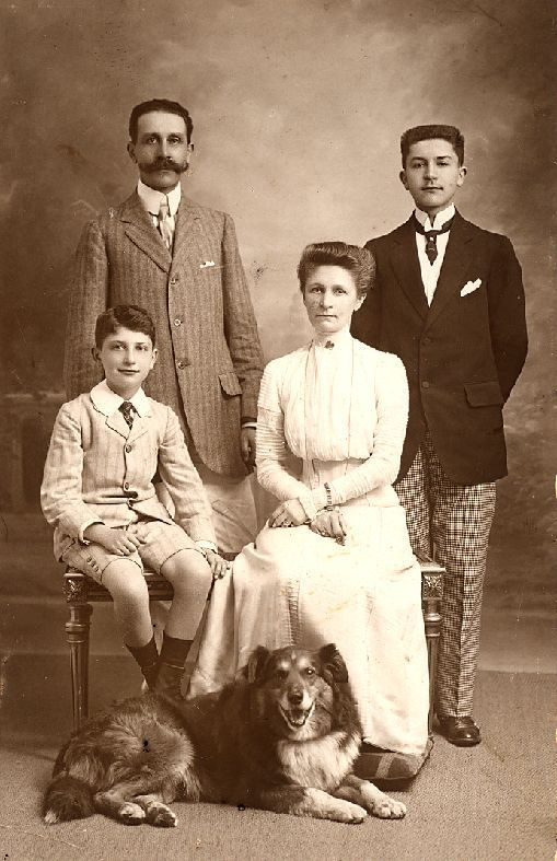 an old photo of a family with a dog