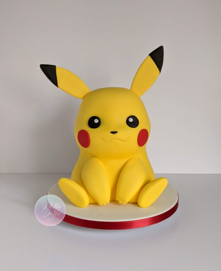 a pikachu figurine sitting on top of a plate