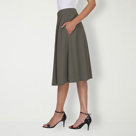 Strut or twirl with confidence in this light and breezy flared skirt. Perfect for keeping cool on a hot summer's day or for adding a touch of style whether you're off to work or a night on the town, this polyester and spandex skirt is as versatile as it is alluring.Front Style: Flat FrontFeatures: Stretch FabricClosure Type: Full ElasticPockets: 2 Side Slip PocketsRise: Mid RiseApparel Length: 23 InchesFiber Content: 95% Polyester, 5% SpandexFabric Description: KnitLining: UnlinedSkirt Length: Spring A-line Bottoms With Elastic Waistband, Stretch A-line Bottoms In Solid Color, Flowy A-line Summer Bottoms, Solid Color Flowy Full Skirt Skort, Flowy Full Skirt Solid Color Skort, Stretch A-line Gathered Skirt Bottoms, Flowy Full Skirt Skort, Casual A-line Bottoms For Day Out, Summer Workwear Knee-length Skirt