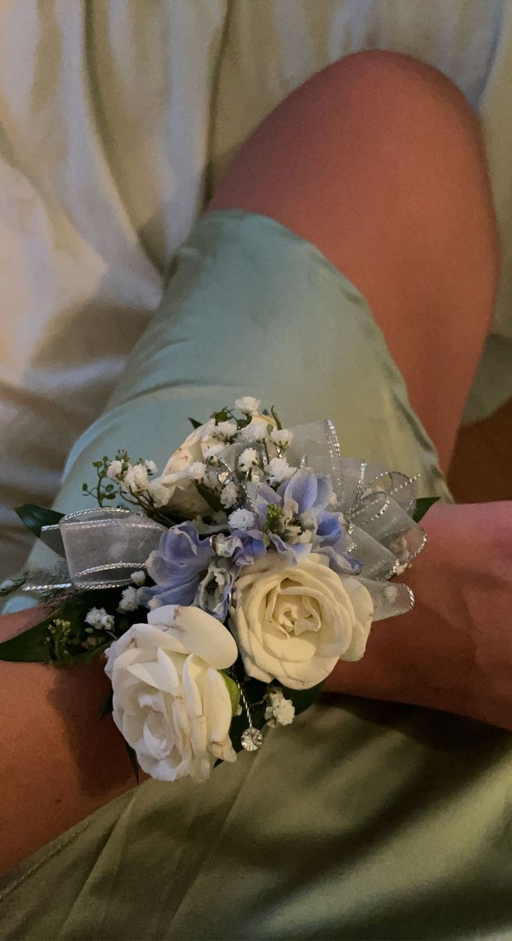 a bride's bouquet is being held by her groom