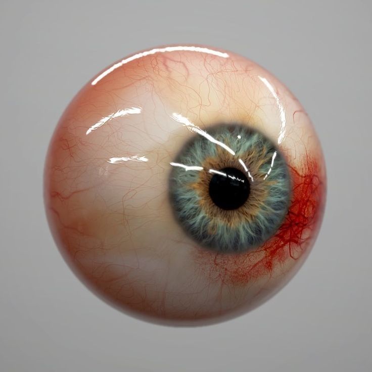 an eyeball with blood running down the middle of it's iris and eyes