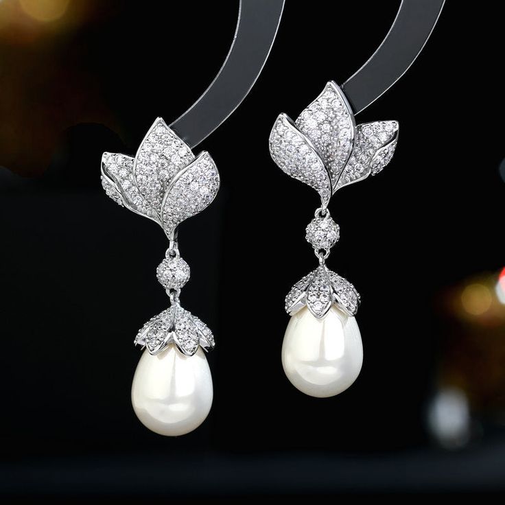 Formal Cubic Zirconia Flower Drop Earrings, Formal Dangle Flower Earrings With Cubic Zirconia, Elegant Pearl Embellished Cubic Zirconia Earrings, Luxury Diamond White Flower Earrings For Wedding, Elegant Diamond Flower Earrings For Wedding, Elegant Diamond Bridal Earrings With Pearl Drop, Elegant Diamond White Pearl Bridal Earrings, Elegant Cubic Zirconia Flower Earrings, Elegant Pearl Earrings With Diamond