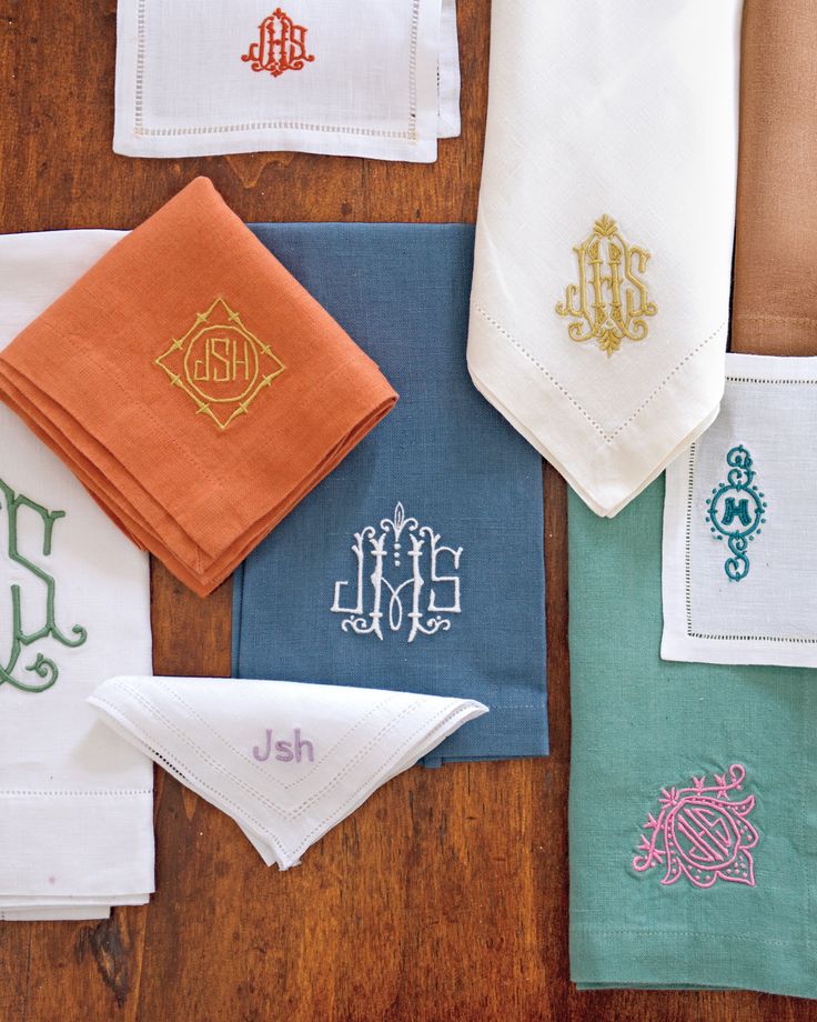 several different colored handkerchiefs with monogrammed embroidered on them