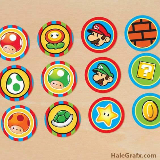 several different types of stickers on a wooden surface, including one with mario and luigi