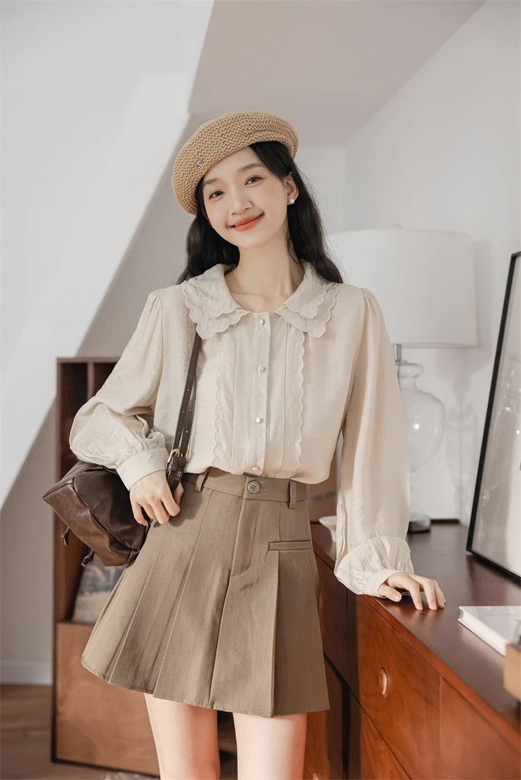 Button up shirt with a double scalloped collar, scallop trim placket details and long blouson sleeves. S: 15" across shoulders, 38.5" chest, 24.5" lengthM: 15.5" across shoulders, 40" chest, 24.5" lengthL: 16" across shoulders, 41.5" chest, 25" lengthXL: 16.5" across shoulders, 43" chest, 25" length Solid Long Sleeve Blouse With Placket, Fitted Long Sleeve Tops With Scalloped Edges, Long Sleeve Office Blouse With Lace Trim, Long Sleeve Blouse With Lace Trim For Office, Casual Fall Blouse With Peter Pan Collar, Casual Peter Pan Collar Blouse For Fall, Fall Workwear Blouse With Peter Pan Collar, Long Sleeve Beige Blouse With Lace Trim, Workwear Tops With Lace Peter Pan Collar