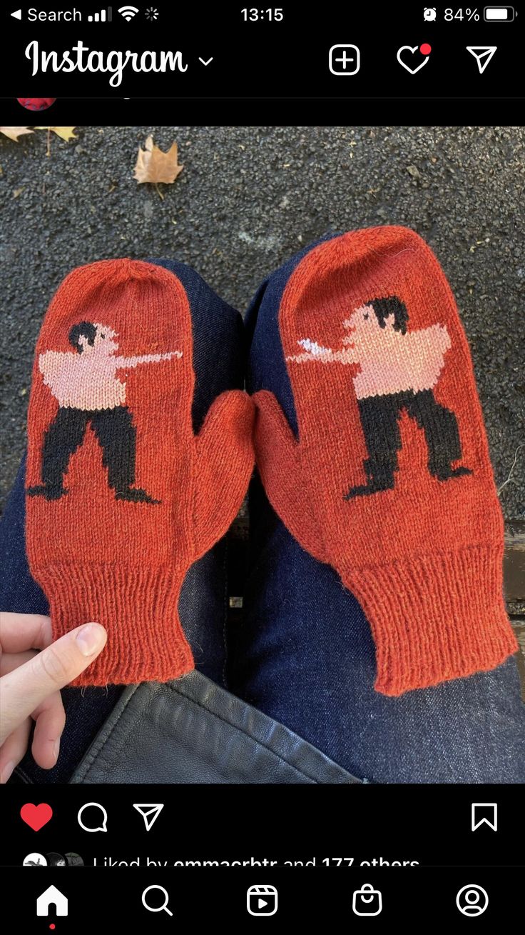 someone wearing mittens with an image of a man on them