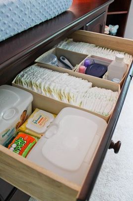 an open drawer in the middle of a bed