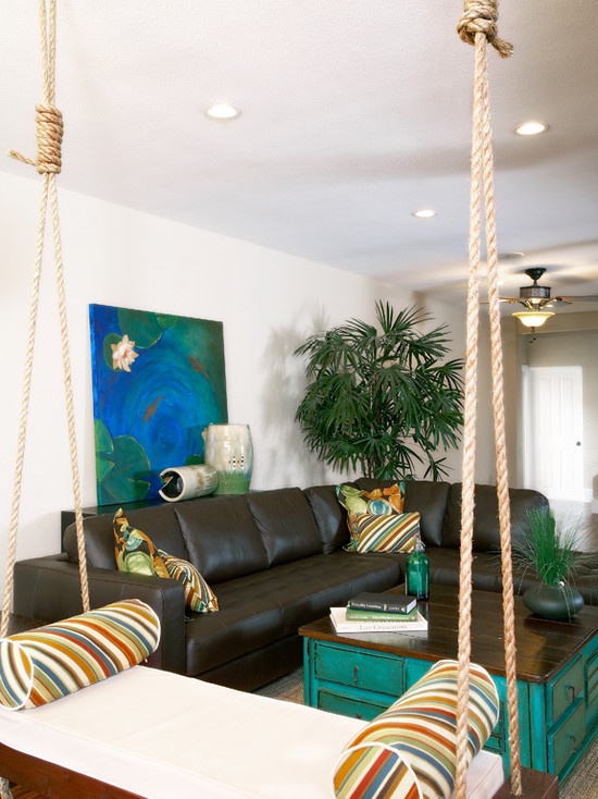 a living room filled with furniture and a wooden floor