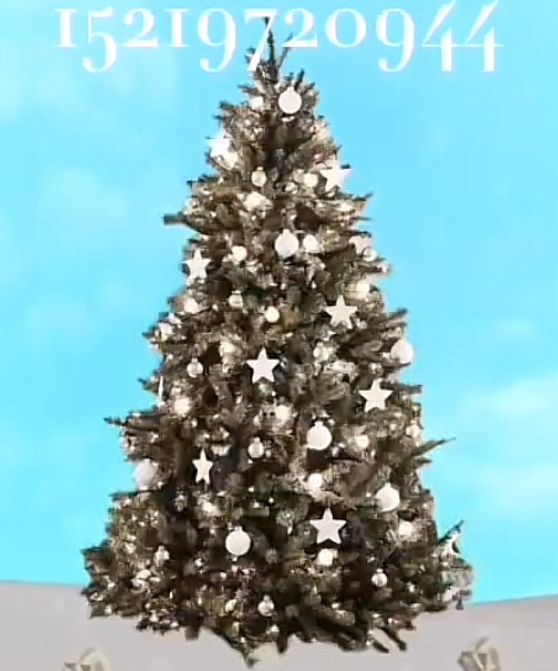 a large christmas tree with white and silver ornaments on it's branches in front of a blue sky