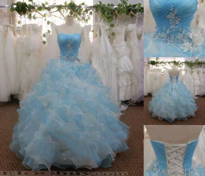 this is an image of a blue and white wedding dress with ruffles on the skirt