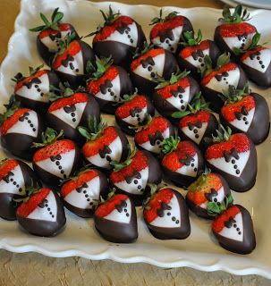 chocolate covered strawberries are arranged on a platter