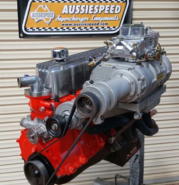 an engine is shown in front of a sign