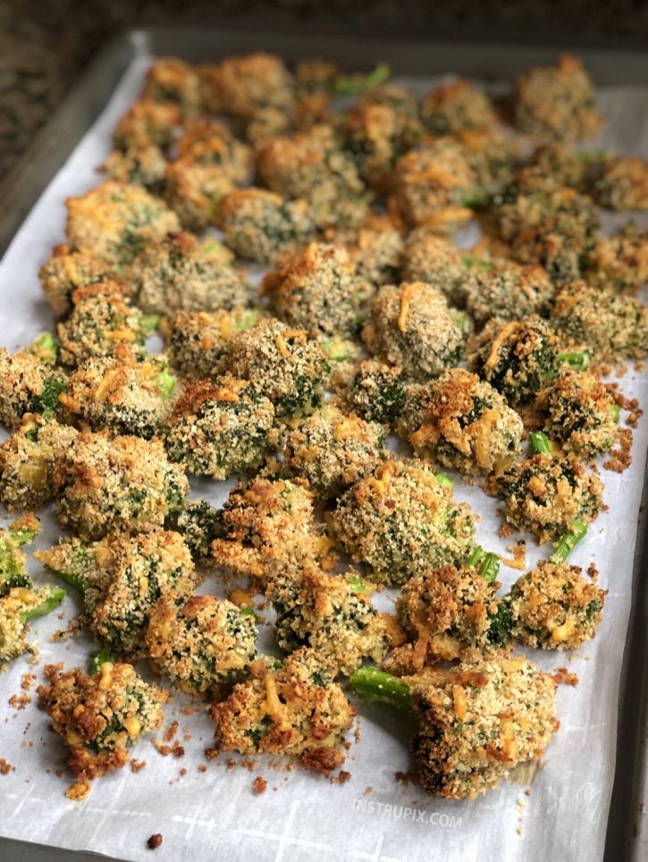 broccoli florets are on a sheet of paper with some seasoning