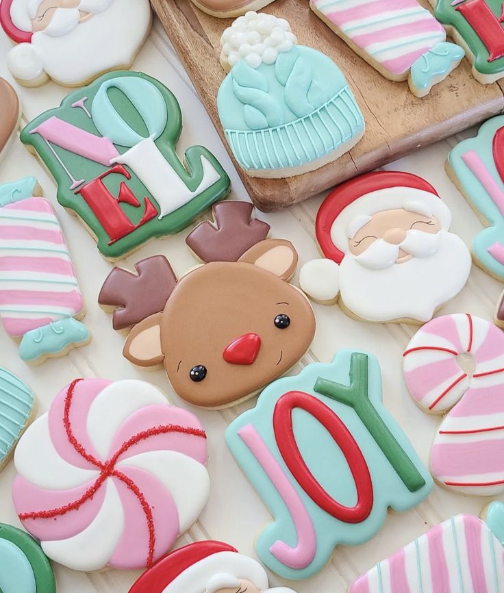 decorated cookies are displayed on a table