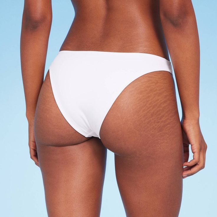 Add a versatile swim separate to your beach-ready closet with this High Leg Extra-Cheeky Bikini Bottom from Shade & Shore™. Made from soft fabric with spandex and full lining for stretchy comfort in and out of the water, this solid-color bikini bottom is designed with a low rise and high leg. The extra-cheeky cut lends you a flattering fit, while the opaque construction offers plenty of coverage for confident wear. Shade & Shore™: Found exclusively at Target. Seamless Solid Swimwear For Vacation, Seamless Solid Swimwear For Beach Party, Lightweight Fitted Beach Bottoms, Lightweight Stretch Beachwear Swimwear, Lightweight Swimwear For Summer Swimming, Seamless Nylon Swimwear For Sunbathing, Fitted Lightweight Swimwear For Beach Season, Stretch Brief Tankini For Poolside, Lightweight Fitted Swimwear For Beach Season