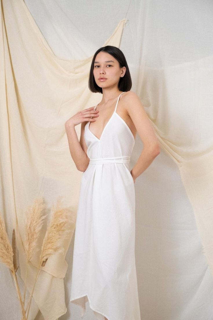 The stylish and minimalist Sage Maxi Dress White is inspired by Tulum’s beaches. It has adjustable straps and an asymmetric hem. Summer Daywear Unlined Maxi Dress, Unlined Midi Dress For Beach, Summer Midi Dress For Brunch, Unlined, Summer Brunch Midi Dress Unlined, Unlined Summer Midi Dress For Brunch, Unlined Maxi Sundress For Summer, Chic Beach Dress With Spaghetti Straps For Day Out, Chic Spaghetti Strap Midi Dress For Beach, Unlined Midi Dress For Vacation