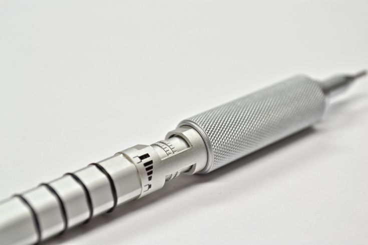 a close up shot of a pen on a white surface