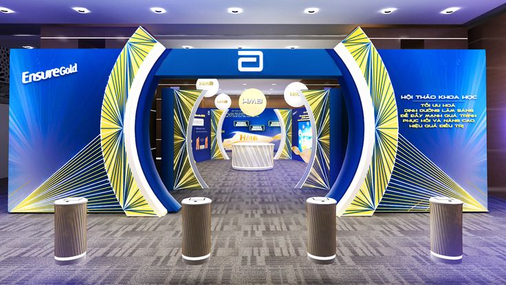 the entrance to an exhibition hall with blue and yellow decorations on it's walls