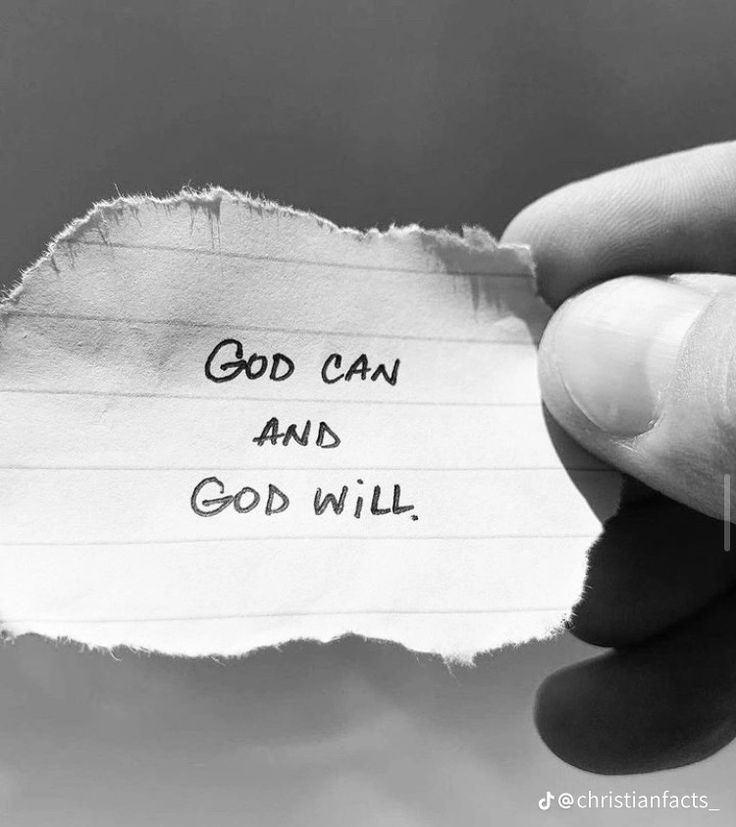 someone holding up a piece of paper with the words god can and god will written on it