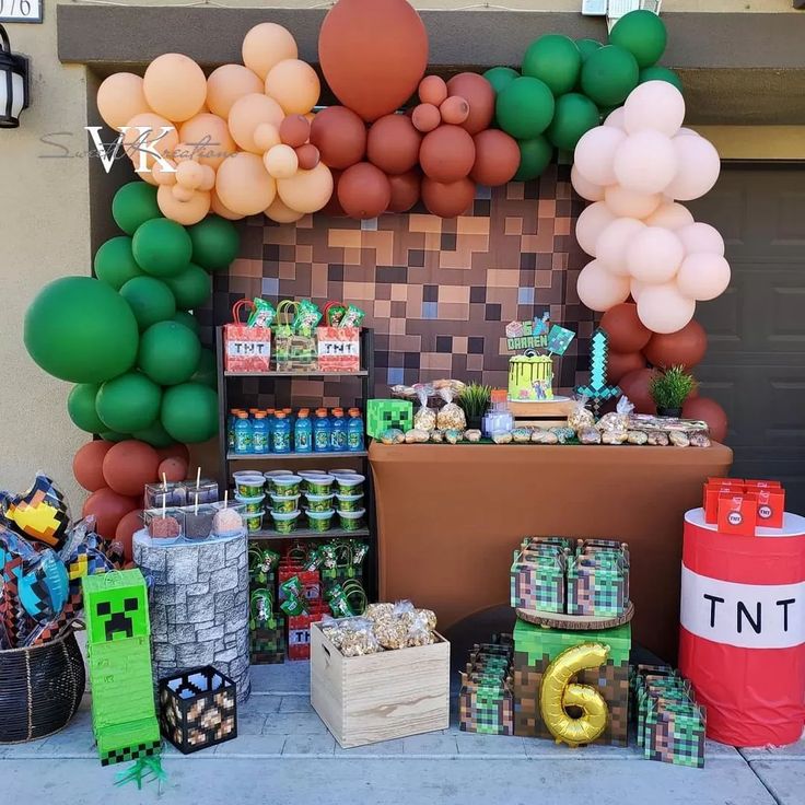 a table topped with lots of balloons and other items