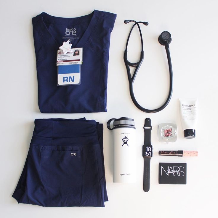 an assortment of personal care items laid out on a white surface with a stethoscope