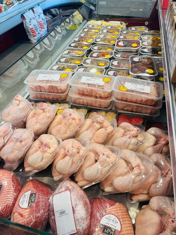 meat in plastic bags on display at a grocery store