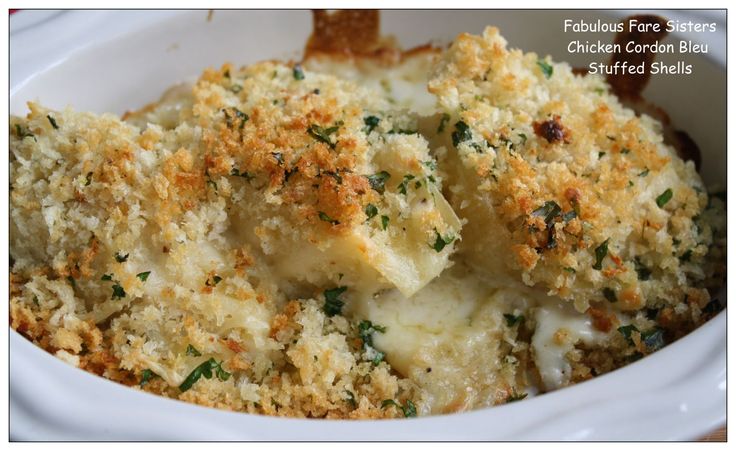 a close up of a casserole dish in a bowl with bread crumbs