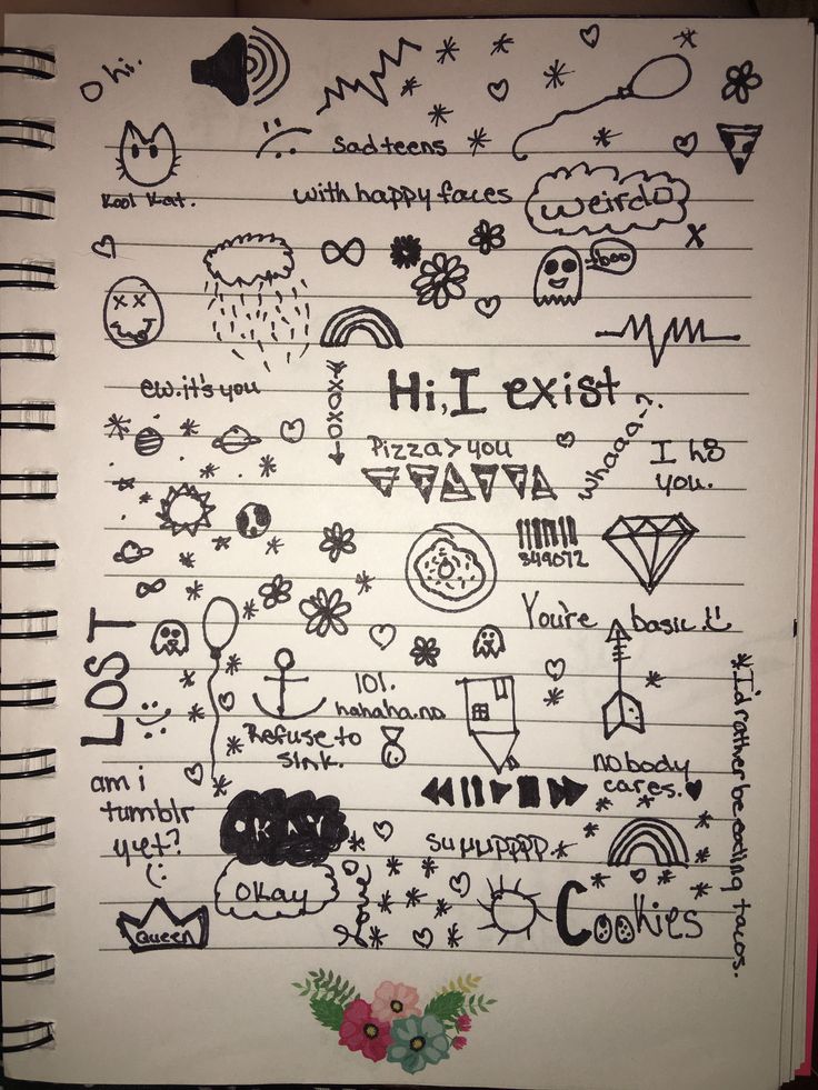 an open notebook with writing on it and flowers in the bottom left corner, along with other doodles