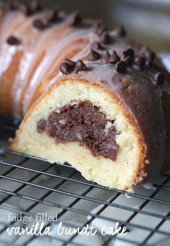 a chocolate cake roll is on a cooling rack