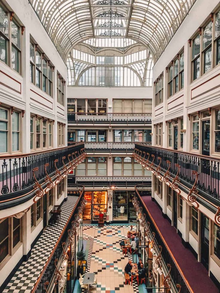 the inside of a large building with many windows and balconies on each floor