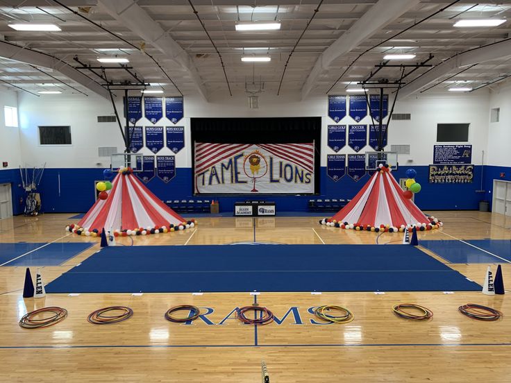 two circus tents in the middle of a gym