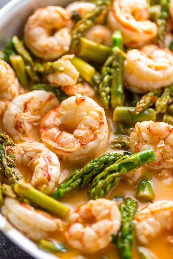 shrimp, asparagus and broccoli in a white bowl