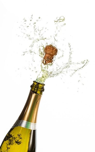 a bottle of champagne is being splashed with water