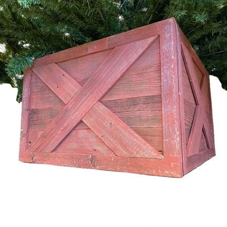 a wooden box sitting in front of a tree