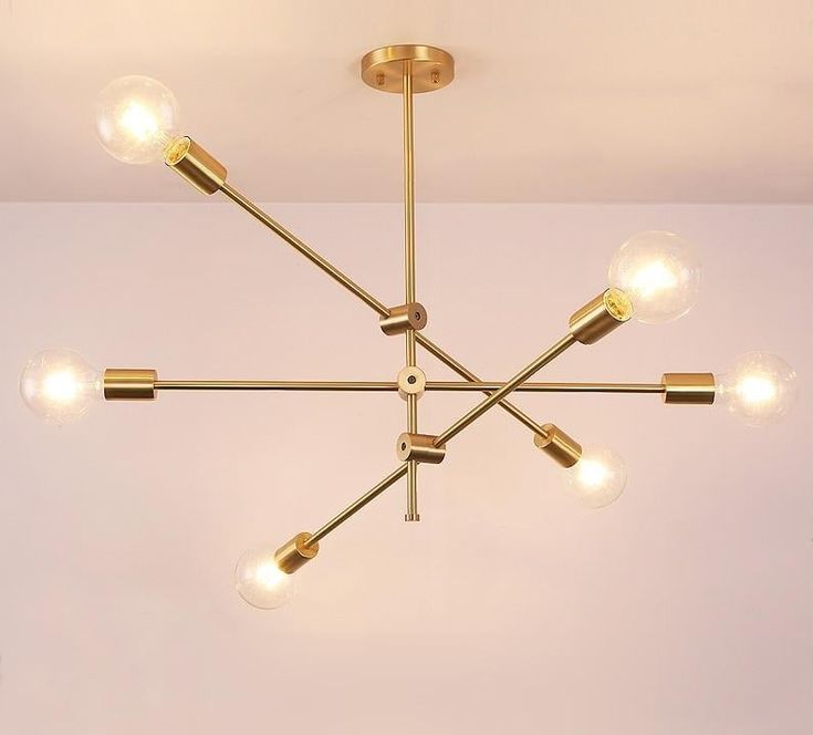 a chandelier hanging from the ceiling with five lights on each end and four bulbs in the middle