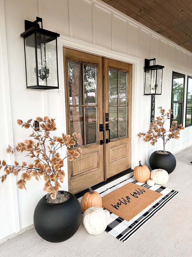 front porch decorated with pumpkins and decorations