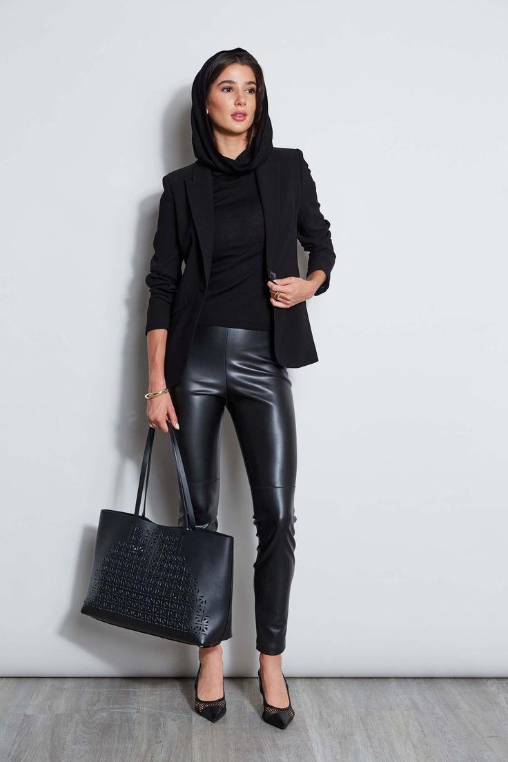 Crafted in our soft-touch Vegan Leather, these leggings accentuate your figure while ensuring comfort all day long. Versatile & Chic, these leggings are great for travel, nights out, and casual chic days and are perfect for pairing with Fall 's must have blazers and knits. Elie Tahari Exclusive Vegan Leather Legging with Seam Detailing 50% Polyester, 50% Polyurethane Runs true to Size Model is 5'10" and wearing size S Measurements: Front Rise: 10.88"L , Inseam: 30'L (approx. length for size S) D Leather Legging, Vegan Leather Leggings, Single Button Blazer, Elie Tahari, Styling Ideas, Blazer Buttons, Leather Leggings, Long Sleeve Lace, Long Sleeve Knit