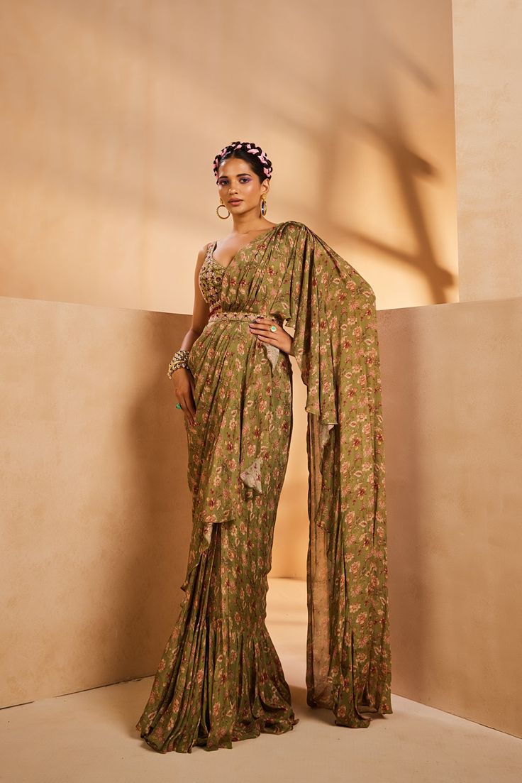 Featuring a pre-draped ruffle sari in a vintage chintz print. The sari features a fully hand embroidered blouse with colourful Japanese beads and sequences.From Aneesh Agarwaal's Seher collection.DELIVERY TIMEPlease allow 8-12 weeks for your outfit to arrive.FABRIC DETAILSChinonProfessional cleaning only. Olive Saree, Chintz Print, Hand Embroidered Blouse, Japanese Beads, Change Image, 12 Weeks, Embroidered Blouse, Body Measurements, Hand Embroidered