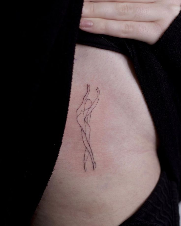 a woman's stomach with a small tattoo on the side of her belly, which has a line drawing of a female figure