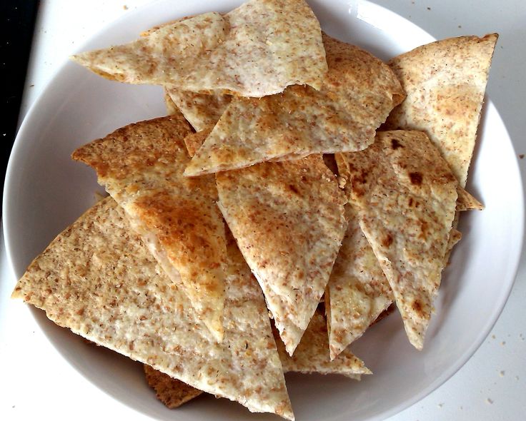 a white plate topped with tortilla chips