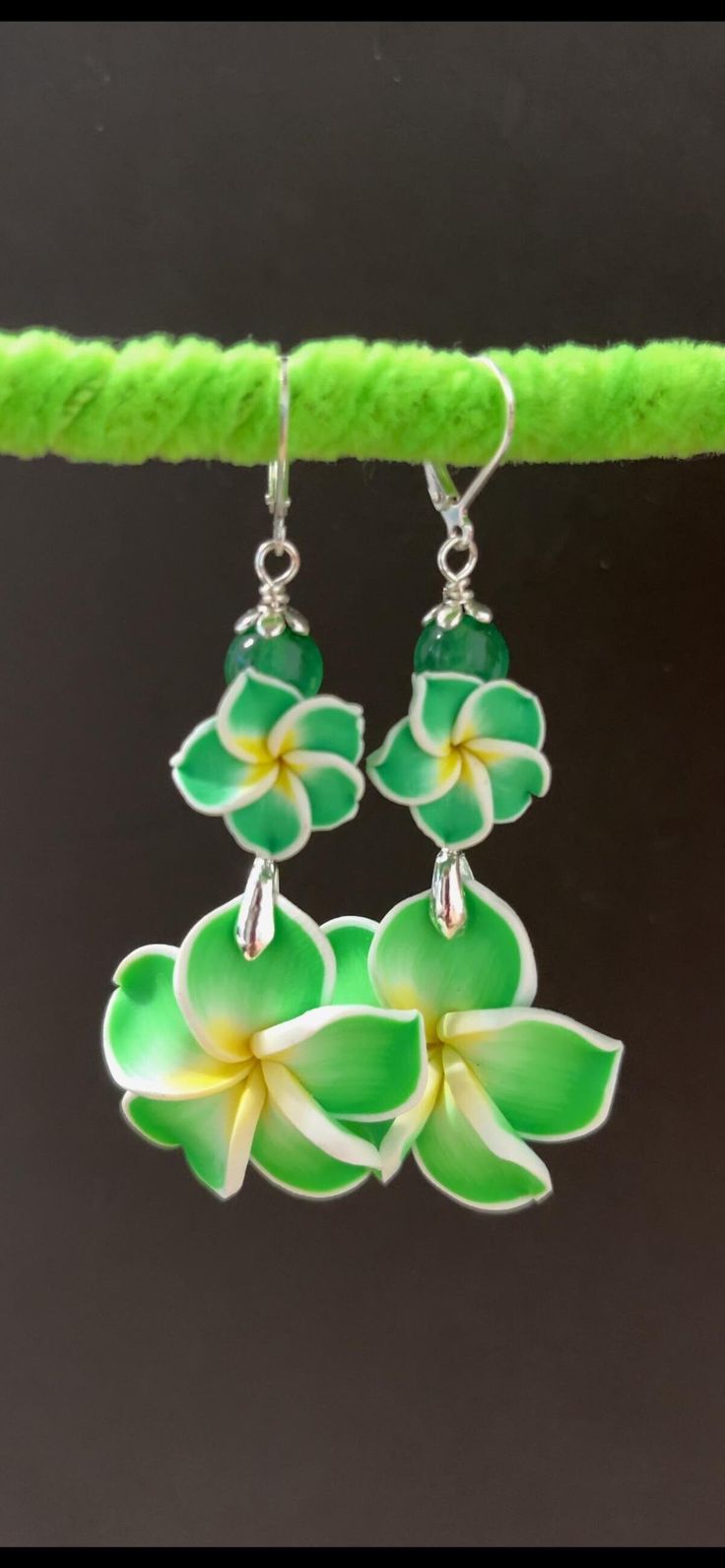 Genuine Jade Stones * * Handmade in Hawaii * * Sterling Silver ear wires * * Order comes with gifts Handmade Green Dangle Flower Earrings, Green Adjustable Dangle Flower Earrings, Green Flower-shaped Earrings For Beach, Green Flower-shaped Earrings For Summer, Trendy Green Flower-shaped Earrings, Cheap Green Flower-shaped Earrings, Nature-inspired Green Dangle Flower Earrings, Green Flower-shaped Beach Earrings, Hypoallergenic Green Flower-shaped Earrings