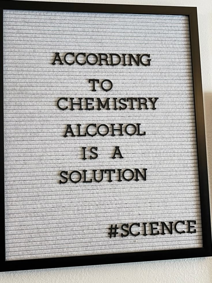 a sign that reads according to chemistry alcohol is a solution science on the side of a wall