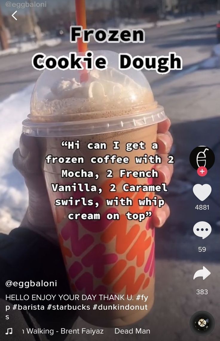 a person holding up a drink in front of their face with the caption frozen cookie dough