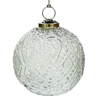 a glass ball ornament hanging from a chain on a white background with clippings