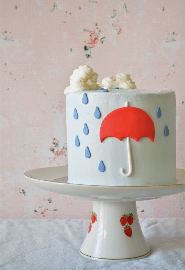 a white cake with an umbrella on top