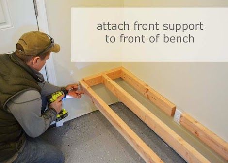 a man is working on some wood in front of a sign that says attach front support to front of bench