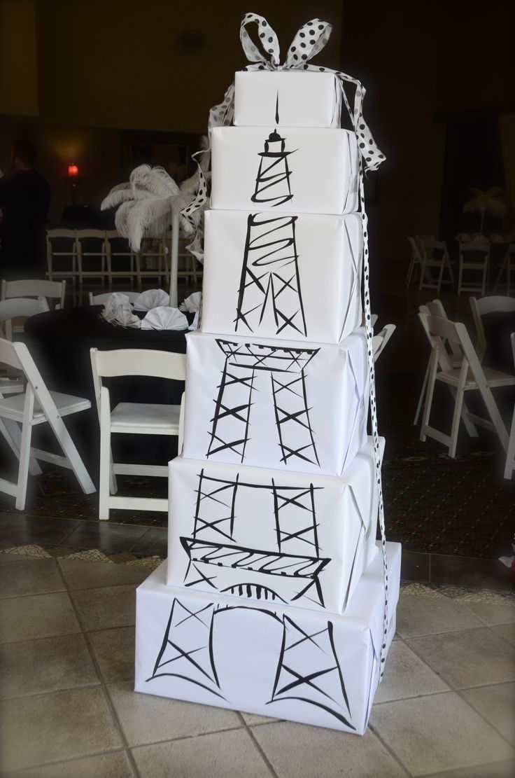 a tower made out of boxes sitting on top of a tiled floor